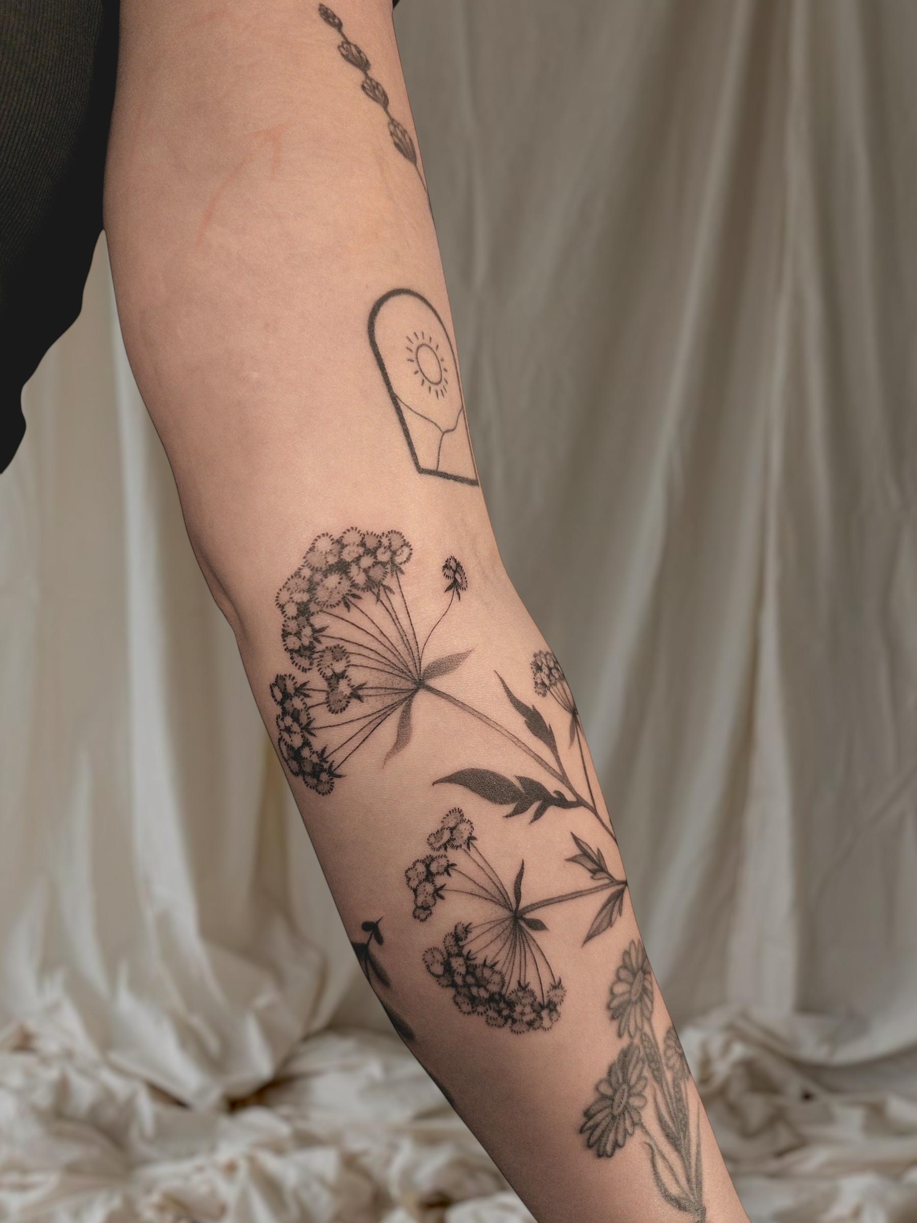 arm tattoo flower wild